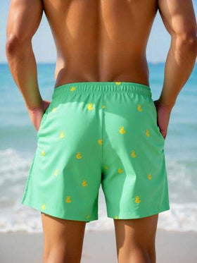 Manfinity Swimmode شورت شاطئ للرجال بخصر مرن مطبوع بطبعات كرتونية وجيوب مائلة