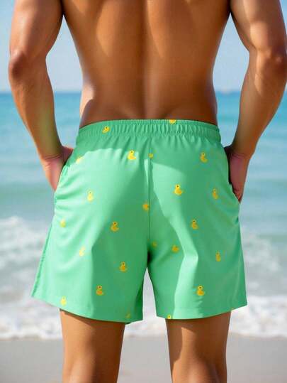 Manfinity Swimmode شورت شاطئ للرجال بخصر مرن مطبوع بطبعات كرتونية وجيوب مائلة