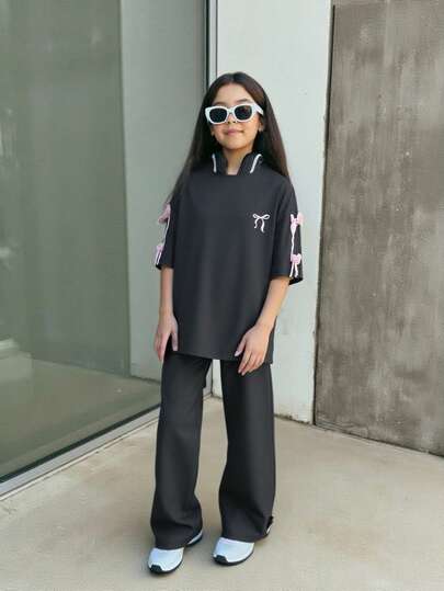 SHEIN Firerie Kids مجموعة تي شيرت فضفاض مطبوع مع فيونكة وبنطلون للبنات المراهقات، موضة كاجوال مريحة للاستخدام اليومي، قطعتان