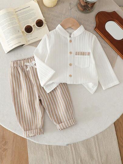 SHEIN Vintaside Kids ملابس علوية أطفال ذو أكمام قصيرة وياقة مع أزرار وجيوب، مع شورت ذو خصر مطاطي، طقم ملابس كاجوال فضفاض مريح، وصول جديد للصيف، قطعتان