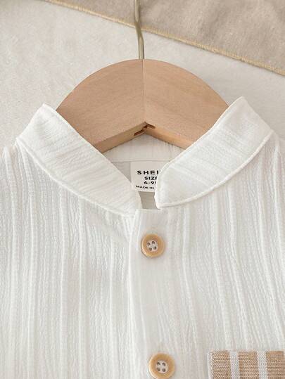 SHEIN Vintaside Kids ملابس علوية أطفال ذو أكمام قصيرة وياقة مع أزرار وجيوب، مع شورت ذو خصر مطاطي، طقم ملابس كاجوال فضفاض مريح، وصول جديد للصيف، قطعتان