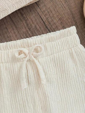 Emery Rose Kids Emery Rose Kids طقم ملابس علوية بدون أكمام وشورت من اللون الأحادي مُحبوك للفتيات الصغيرات، قطعتان