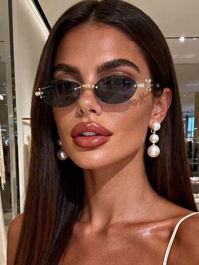 زوج من نظارات شمسية بإطار بيضاوي بدون إطار مزينة بالراين ستون باللون الأسود للنساء والرجال، مناسبة للحفلات والسفر ومهرجانات الموسيقى والرياضة والقيادة والملابس العطلات والشاطئ والخروجات والصيف والاكسسوارات والعطلات والخروجات العائلية والملابس الأنيقة والم
