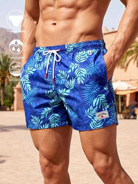 Manfinity Swimmode شورت شاطئ رجالي مطبوع بالنباتات مع جيب مائل وخصر رباط، شورت شاطئ رجالي مطابق للزوجين مع خصر رباط وجيب أمامي مربوط، شورت سباحة رجالي بطبعة أشجار النخيل باللون الأزرق، شورت سباحة رجالي باللون الأزرق، ملابس شاطئ رجالية