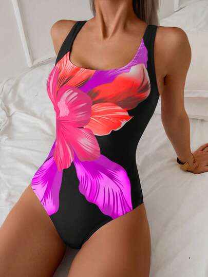 Swim Basics بدلة سباحة أنيقة للنساء بطبعة زهور كبيرة متعددة الألوان، رقبة دائرية وساق طويلة، مناسبة للصيف
