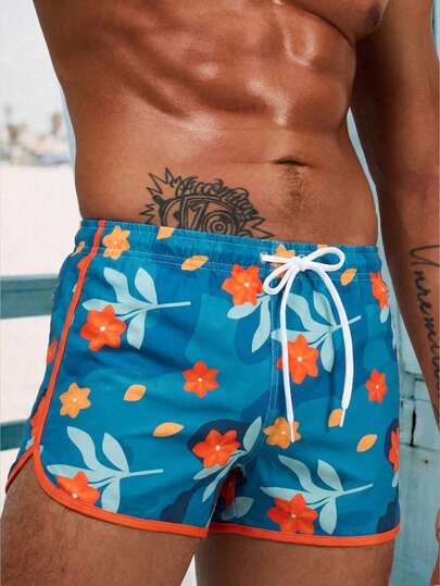 Manfinity Swimmode شورتات شاطئ رجالية مطبوعة بالزهور مع خصر رباط وجيوب، بدلة سباحة مطابقة للرجال، بدلة سباحة للرجال، ملابس شاطئ للرجال، شورتات سباحة رجالية، بدلة سباحة رجالية أزرق بنقشة زهور، مجموعة بدلة سباحة رجالية بنقشة الزهور