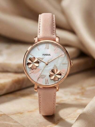 Fossil ساعة نسائية ذات إطار وردي ذهبي ثلاثي الأبعاد بعقارب ذات أرقام رومانية أنيقة وقرص من الأم اللؤلؤ، مع سوار جلد وردي أصلي. هدية رائعة للمرأة.