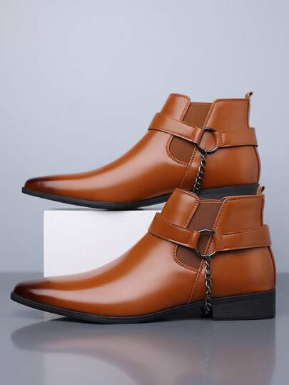 زوج من بوت تشيلسي الكاجوال للرجال ذات الجزء العلوي من جلد البولي يوريثان والنعل المطاطي، ذات رقبة متوسطة الارتفاع وأصبع مدبب، ذات كعب منخفض مريح للاستخدام في الأعمال