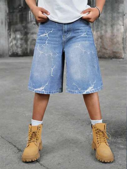 SHEIN شورت جينز واسع الساق بتصميم نمط شارع مبسط بقصة رجعية ممزقة وملمس مهترئ للأولاد المراهقين، ملابس يومية للأولاد المراهقين وملابس ربيع وصيف للحفلات والمهرجانات والملابس الشارعية