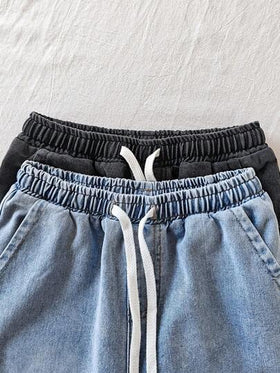 SHEIN قطعتان من شورتات الجينز الفضفاضة بتصميم كاجوال وعتيق وأنيق بلون أزرق وأسود للأولاد المراهقين، مجموعة مكونة من قطعتين للملابس اليومية للأولاد المراهقين وملابس الربيع والصيف وملابس الحفلات والملابس الشارعية