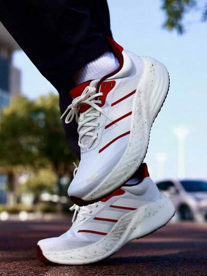 Adidas حذاء أديداس كوشنوفا للسفر، خفيف الوزن للغاية، مصنوع من قماش مريح، مناسب للجري على الطرق الوعرة، للجنسين، أبيض وأحمر