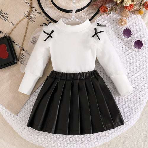 موضة 2025 جديد بنت ربيع وخريف طقم solid color knitted أكمام طويلة توب+solid color fashion قصير جيب 2-piece طقم
