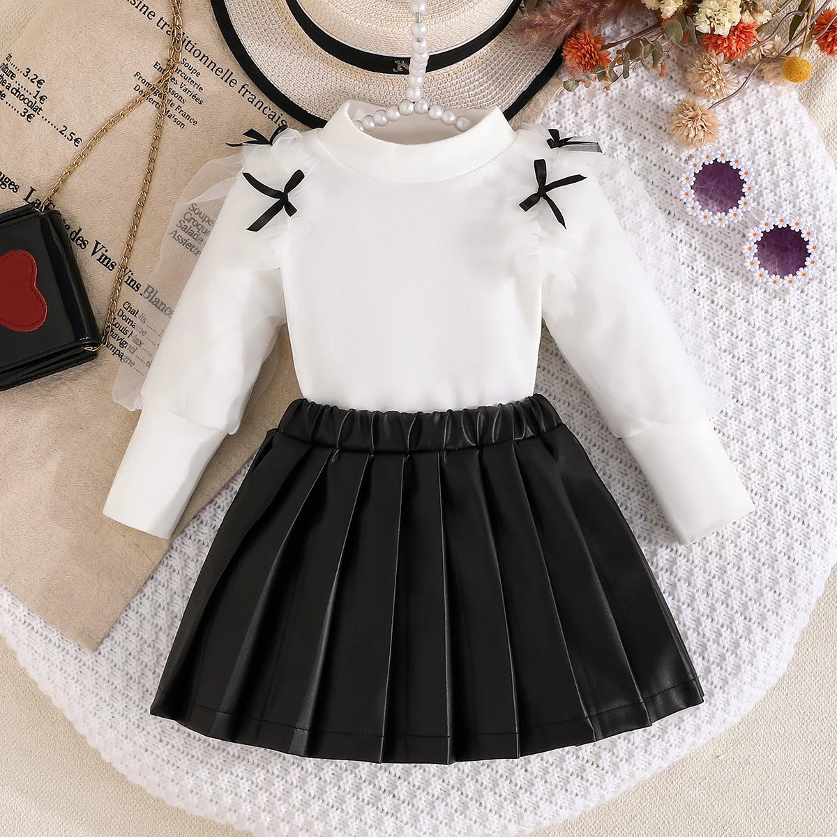 موضة 2025 جديد بنت ربيع وخريف طقم solid color knitted أكمام طويلة توب+solid color fashion قصير جيب 2-piece طقم