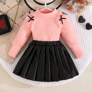 موضة 2025 جديد بنت ربيع وخريف طقم solid color knitted أكمام طويلة توب+solid color fashion قصير جيب 2-piece طقم